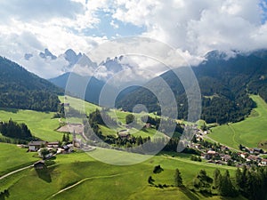 Aerial view of the landscapes of the village Funes in Dolomites mountain range, South Tyrol, Italy