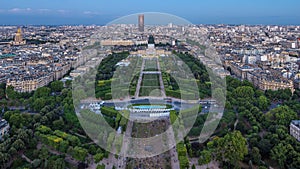 Aerial view of a large city skyline after sunset day to night timelapse. Top view from the Eiffel tower. Paris, France.