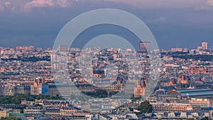 Aerial view of a large city skyline at sunset timelapse. Top view from the Eiffel tower. Paris, France.