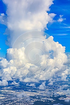 Aerial view of a large cumulous cloud above the Miami International Airport in Florida