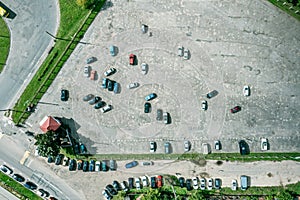 Aerial view of large empty car parking on sunny summer day