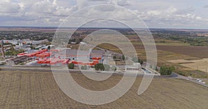 Aerial view of a large factory. Industrial exterior of a modern factory with orange decoration