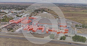 Aerial view of a large factory. Industrial exterior of a modern factory with orange decoration