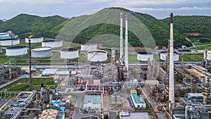 Aerial view of large fuel storage tanks at oil refinery industrial zone, White oil storage tanks farm.