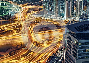 Aerial view of large highway junction in Dubai, UAE, at night