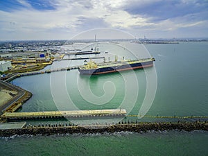 Aerial view of large industrial nautical vessel moored at docks in Williamstown, Melbourne, Australia.