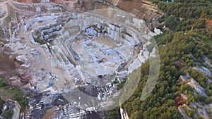 Aerial view of a large marble quarry during sunset