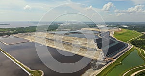 Aerial view of large open air phosphogypsum waste stack near Tampa, Florida. Potential danger of disposing byproduct of