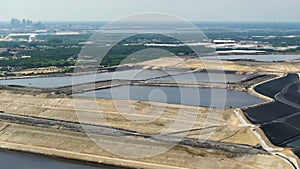 Aerial view of large open air phosphogypsum waste stack near Tampa, Florida. Potential danger of disposing byproduct of