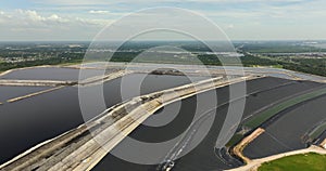 Aerial view of large open air phosphogypsum waste stack near Tampa, Florida. Potential danger of disposing byproduct of