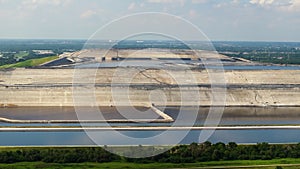 Aerial view of large open air phosphogypsum waste stack near Tampa, Florida. Potential danger of disposing byproduct of