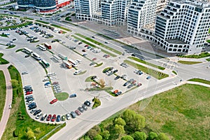 Aerial view of large parking lot with cars city residential area