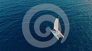 Aerial view. Large sailing catamaran in the open sea.