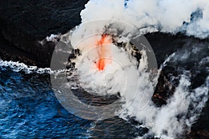 Aerial view of lava flowing into the Ocean off Hawaii