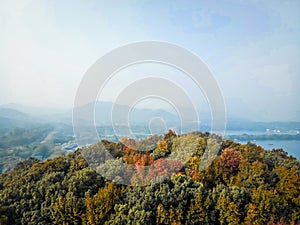 Aerial view from Leifeng Pagoda West Lake and cityscape at sunrise on autumn, Xihu District, Hangzhou, Zhejiang, China .