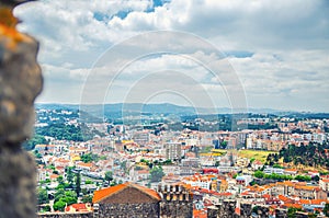 Aerial view of Leiria city residential districts and green hills background, Beira Litoral province photo