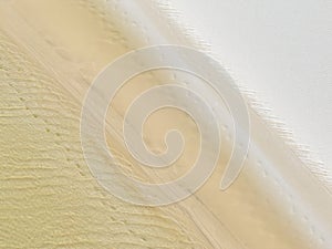 Aerial view of Lencois Maranhenses. White sand dunes with pools of fresh and transparent water. Desert. Brazil