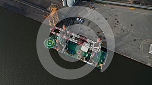 Aerial view of Liebherr Seafox 5 offshore crane moored in front of Esbjerg's Power Station in Denmark. With a maximum