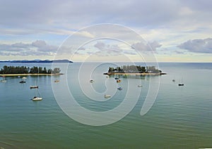 Aerial view of a Lighthouse, boat and yatches docked in marina