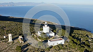 Aerial view of the lighthouse of Cabo Santapola, in the Spanish Mediterranean coast. photo