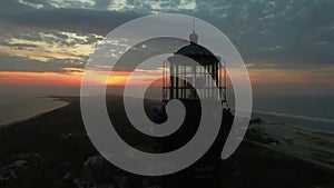 Aerial View of a Lighthouse Close Up on a Easter Sunday SunRise