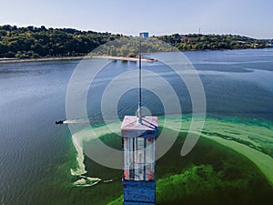 Aerial view of the lighthouse surrounded by algal bloom