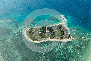 Aerial view of a lighthouse on a tropical island