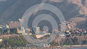 Aerial view of Lima's Coastline with mountain in background timelapse, Lima, Peru. photo