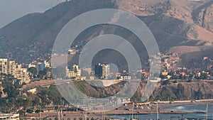 Aerial view of Lima`s Coastline with mountain in background timelapse, Lima, Peru.