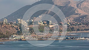 Aerial view of Lima's Coastline with mountain in background timelapse, Lima, Peru. photo