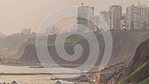 Aerial view of Lima's Coastline in the neighborhood of Miraflores day to night timelapse, Lima, Peru photo