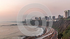 Aerial view of Lima's Coastline in the neighborhood of Miraflores day to night timelapse, Lima, Peru photo