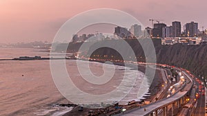 Aerial view of Lima's Coastline in the neighborhood of Miraflores day to night timelapse, Lima, Peru photo