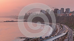 Aerial view of Lima's Coastline in the neighborhood of Miraflores during sunset timelapse, Lima, Peru