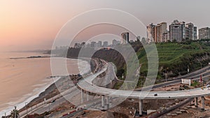 Aerial view of Lima's Coastline in the neighborhood of Miraflores during sunset timelapse, Lima, Peru