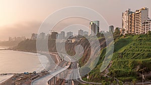 Aerial view of Lima's Coastline in the neighborhood of Miraflores during sunset timelapse, Lima, Peru photo