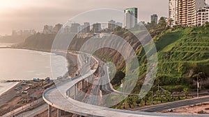 Aerial view of Lima's Coastline in the neighborhood of Miraflores during sunset timelapse, Lima, Peru photo