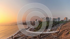 Aerial view of Lima's Coastline in the neighborhood of Miraflores during sunset timelapse, Lima, Peru photo