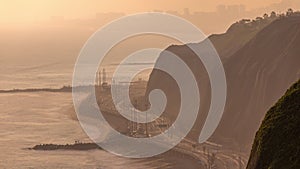 Aerial view of Lima's Coastline in the neighborhood of Miraflores timelapse during sunset, Lima, Peru