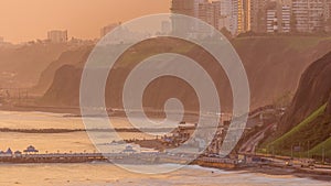 Aerial view of Lima's Coastline in the neighborhood of Miraflores timelapse during sunset, Lima, Peru