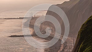 Aerial view of Lima's Coastline in the neighborhood of Miraflores timelapse during sunset, Lima, Peru photo