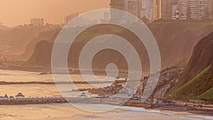 Aerial view of Lima's Coastline in the neighborhood of Miraflores timelapse during sunset, Lima, Peru photo