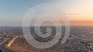 Aerial view of Lima skyline day to night timelapse from San Cristobal hill.