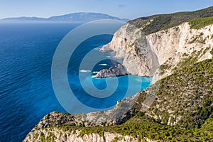 Aerial view of limestone cliffs close to Navagio or Shipwreck Beach on Zakynthos Island, Greece. Summer vacation travel