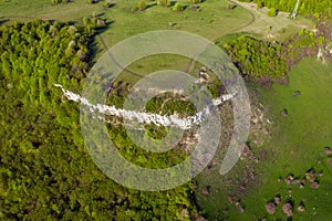 Aerial view of limestone cliffs and Green forest in the spring. Geological formation