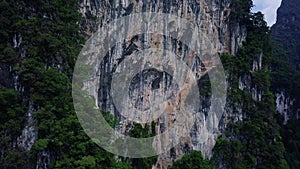 Aerial view of limestone rocks covered with lush tropical greenery. Top view of mountains in Krabi and Suratthani