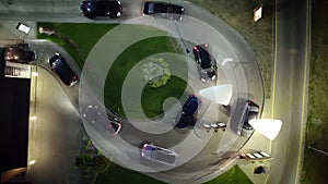 Aerial view of a line of cars queuing at the Drive-through window of a restaurant to pick up their order's food