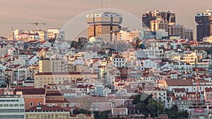 Aerial view of Lisbon skyline with Amoreiras shopping center towers timelapse from Almada at sunset. Lisbon, Portugal