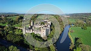 Aerial view of Lismore Castle, County Waterford, Ireland, under a flawless blue sky