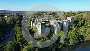 Aerial view of Lismore Castle, County Waterford, Ireland, under a flawless blue sky
